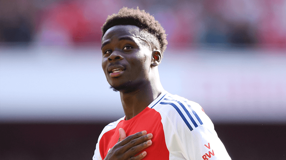 Bukayo Saka celebrates scoring against Wolves